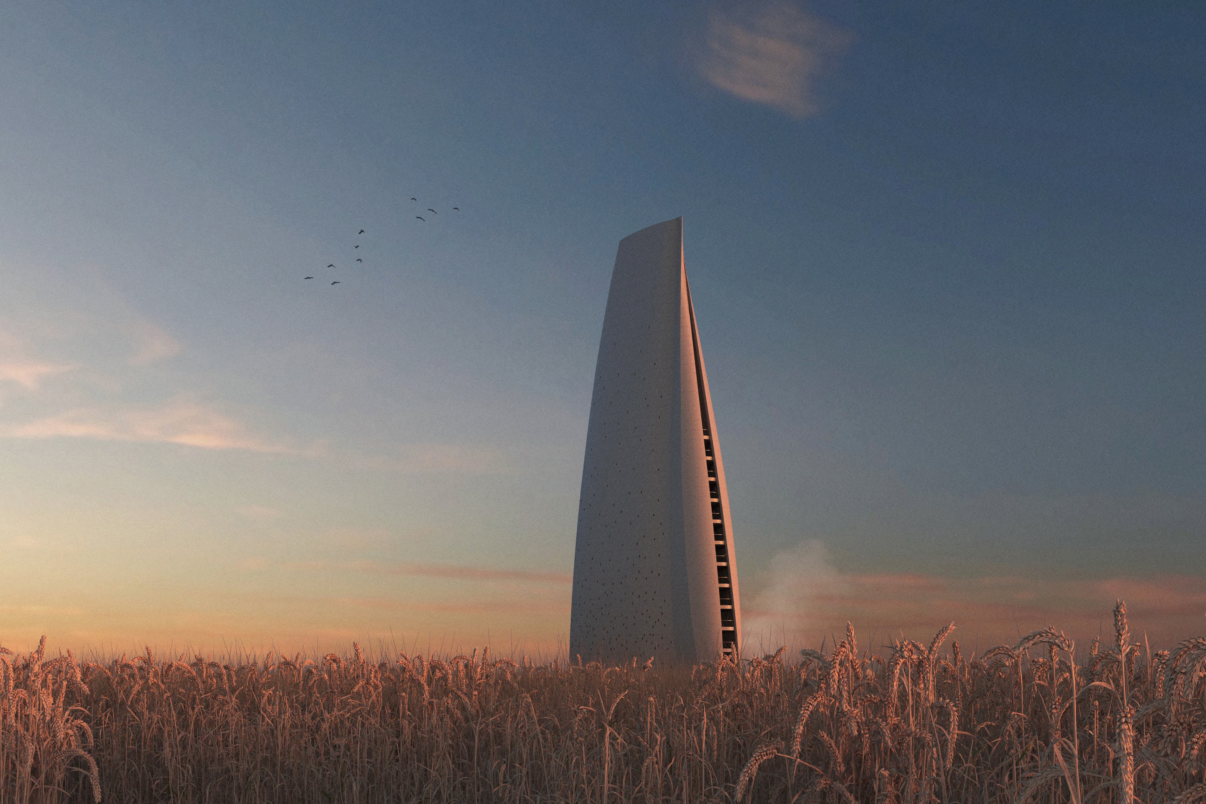 Tower rising from wheat field at sunset